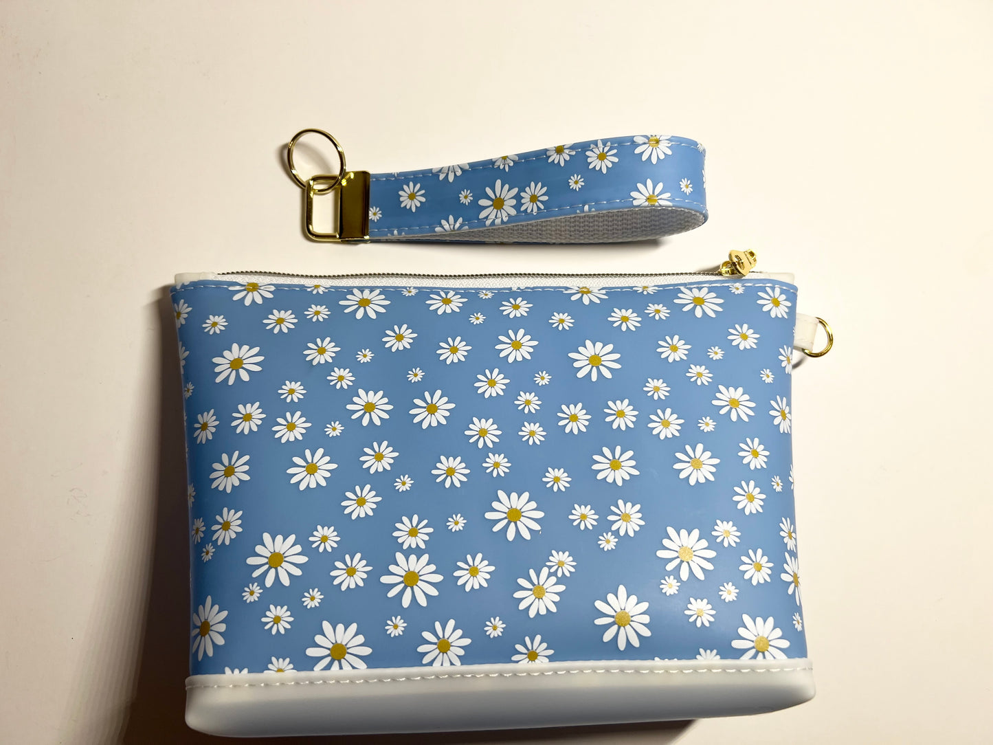 Introducing the Jelly Fabric Daisy Print Blue Makeup Bag! 8.5”W x 5.5”H
