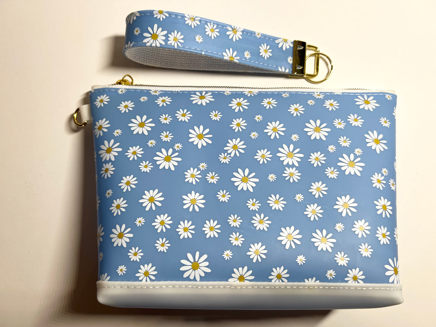 Introducing the Jelly Fabric Daisy Print Blue Makeup Bag! 8.5”W x 5.5”H